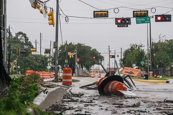  Debris and damaged road construction are left after Tropical Storm Nicholas moved through Texas