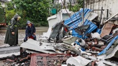 Rescuers clean up debris after an earthquake that killed three and injured a dozen in Luzhou