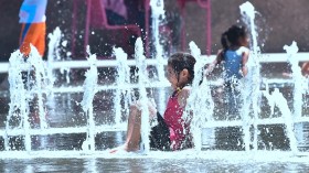 A child playing at a splash pad 