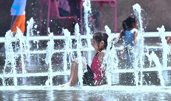 A child playing at a splash pad 