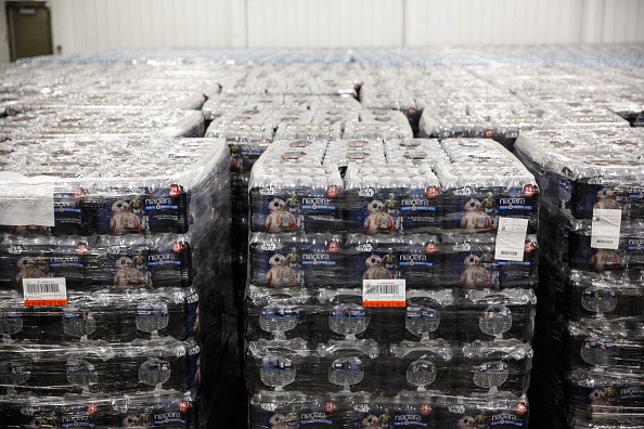 Pallets of bottled water are seen ready for distribution in a warehouse which is an emergency water supply for residents affected by lead-contaminat