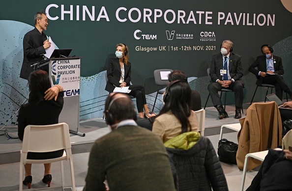 Former US Vice President Al Gore (2R) attends a panel discussion at the China Corporate Pavilion during the COP26 UN Climate Change Conference in Glasgow, Scotland 
