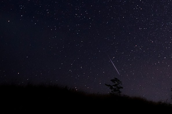 Meteor streaking through the night sky