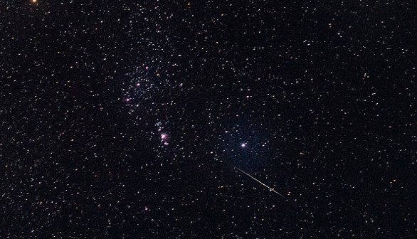 Meteor streaking through the night sky 