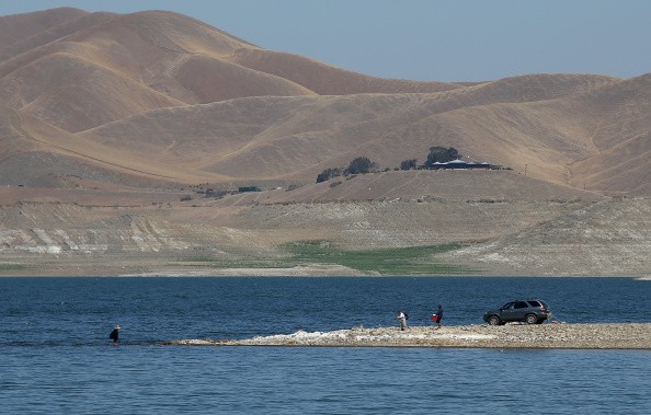 Car parked on a section of the San Luis Reservoir that used to be under water.