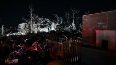 A baby crib is pictured in a badly damaged house after extreme weather hit the region, in Mayfield, Kentucky on December 13, 2021