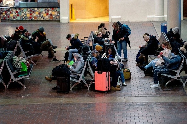 Travelers sitting at Union Station during a winter storm