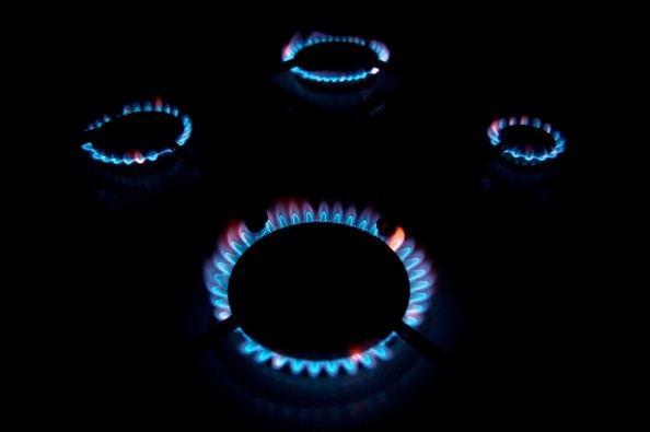 Flames of gas cooker rings on a stove.