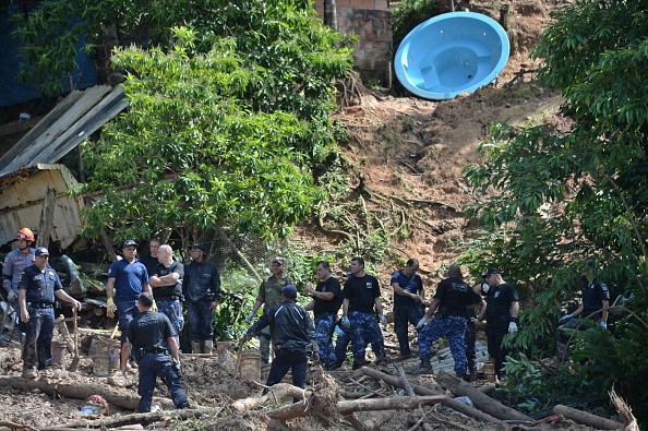 Search for victims of a landslide triggered by torrential rains 