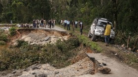 Partially collapsed RN25 road in Ranomafana after the passage of cyclone Batsirai.