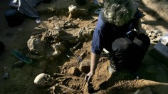 An Israeli archeologist excavates an ancient Roman cemetery