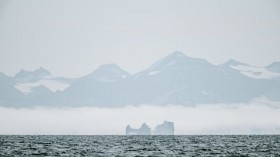 Iceberg in the Arctic on a hazy afternoon