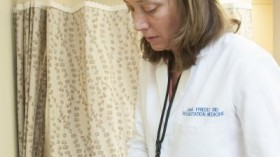 Dr. Janna Friedly, an assistant professor of rehabilitation medicine at the University of Washington in Seattle, examines a patient's leg and foot in her clinic.