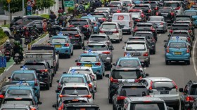 Motorists commute in a traffic jam in Jakarta on December 13, 2022