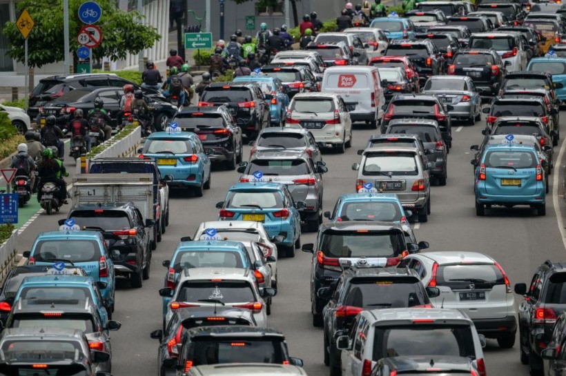 Motorists commute in a traffic jam in Jakarta on December 13, 2022