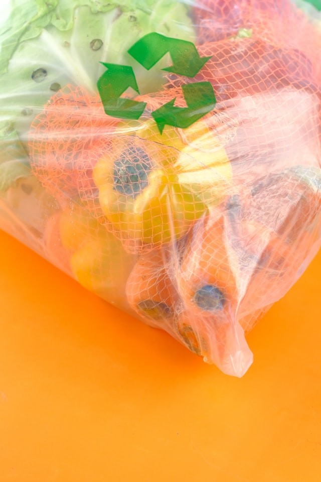 white green and orange plastic bag photo