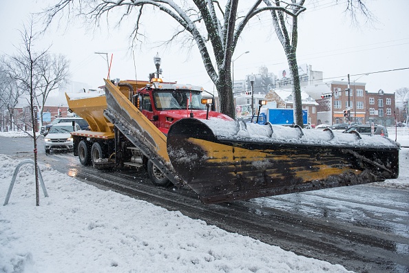 A snow plow on streets of Quebec City. Low-Pressure in Atlantic Canada to Dump Significant Snowfall This Week; Nova Scotia, New Foundland Could Experience Strong Winds, Snow 