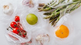 Assortment of fresh vegetables and fruits put in plastic bags