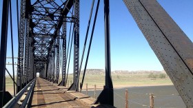 Potential Hazmat Spill: Bridge Collapse Causes Freight Train to Dunk Asphalt, Sulfur Into Yellowstone River