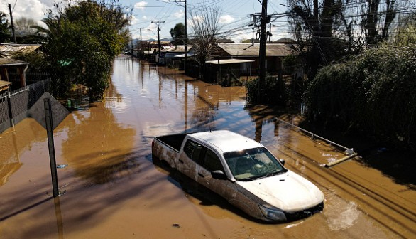 A vehicle remains on a flooded street after heavy rains in Santa Cruz, Chile on August 23, 2023.