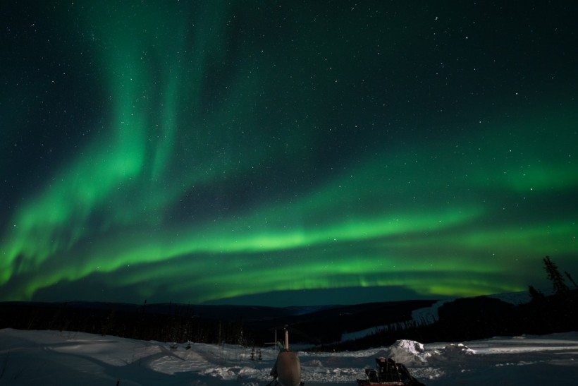 Eerie Bright Green Auroras Fill Skies Amid Alaska's Aurora Season 