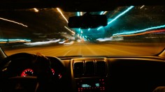 car zooming along long exposure