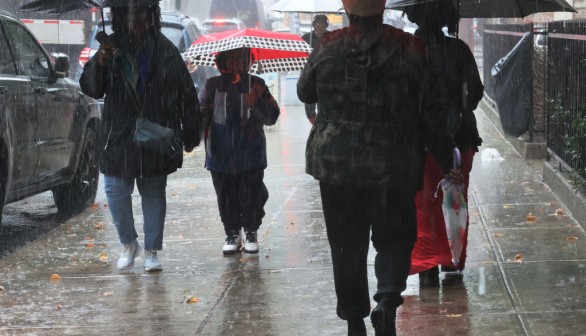 A photo of persons holding umbrellas in Brooklyn borough New York City.