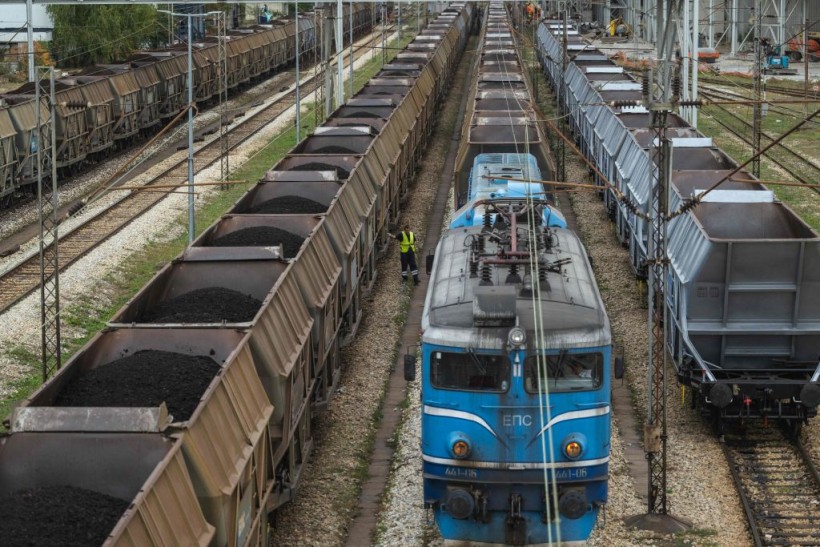 A stock photo a train carrying loads of coal