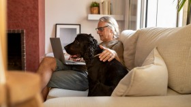 Side view old man petting dog