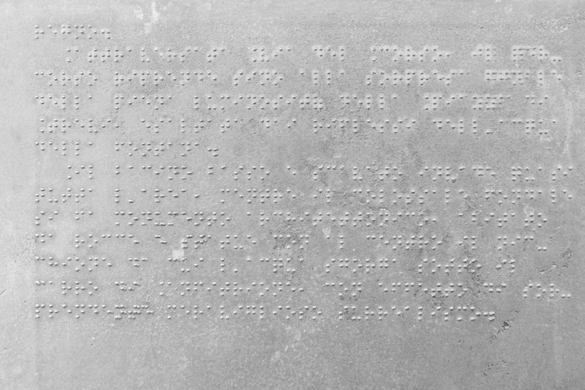Sign in Braille explaining the history of the Trevi Fountain, Rome, Italy