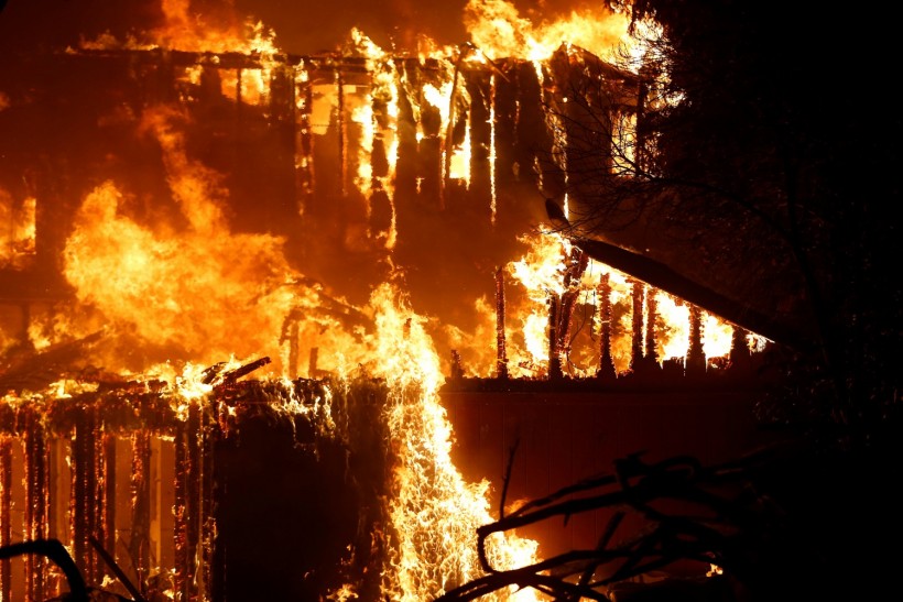 A structure burns during the Kincade fire in Geyserville, California